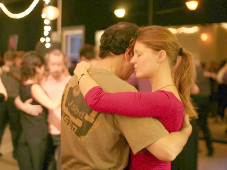 Couple dancing tango at a milonga in Buenos Aires