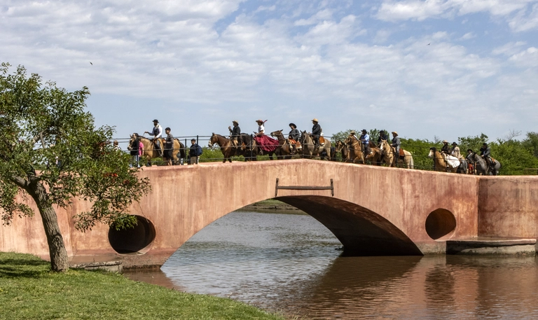 Gaucho parade crossing the bridge on Areco river