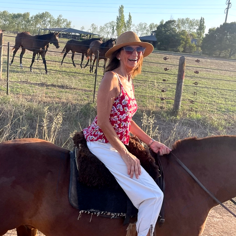 Patricia Jacovella riding in the Argentine countryside