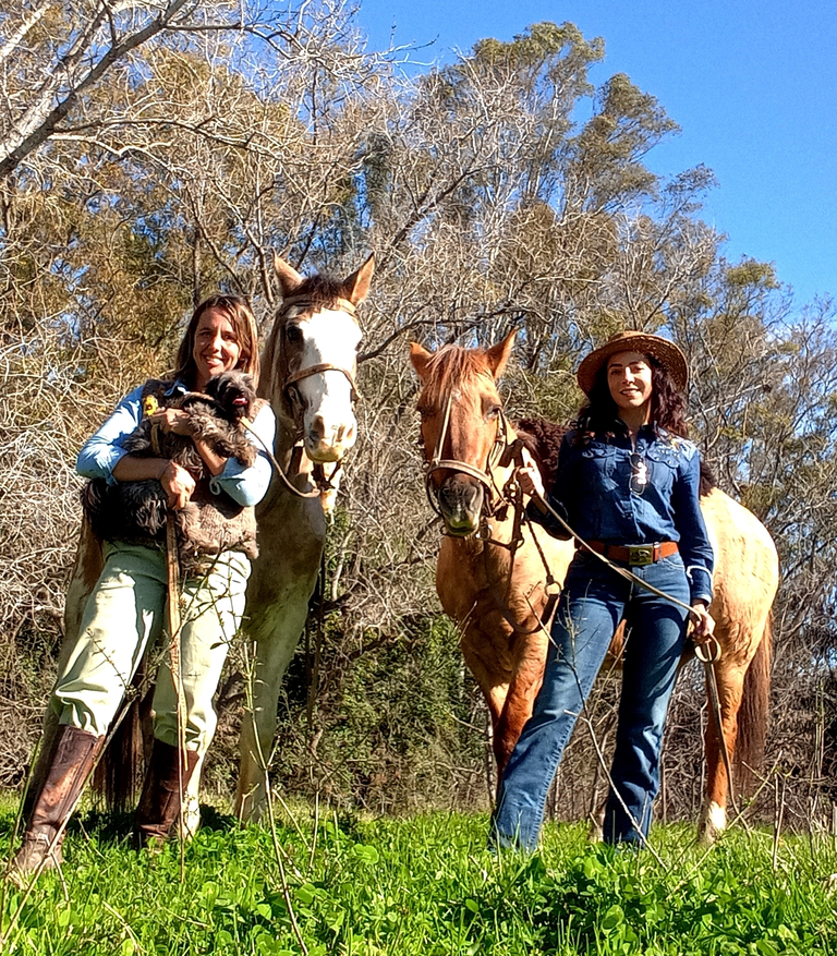 Dimitra horseback riding near the river